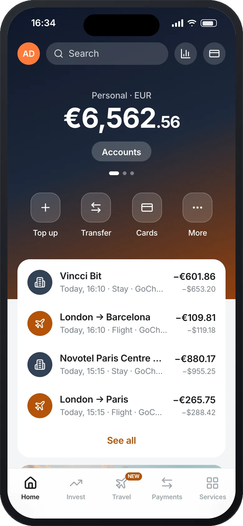 A banking app home screen: the EUR balance, and at the top of the account feed a Barcelona hotel stay and a London to Barcelona flight booked a moment ago, each shown in euros with the original dollar amount underneath.